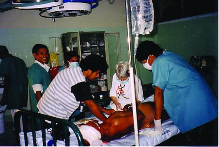 Patricia Coyle and colleagues in operating theatre, Baucau Hospital East Timor 1999, Copyright University of Sydney